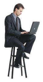 Man on a Stool With a Laptop